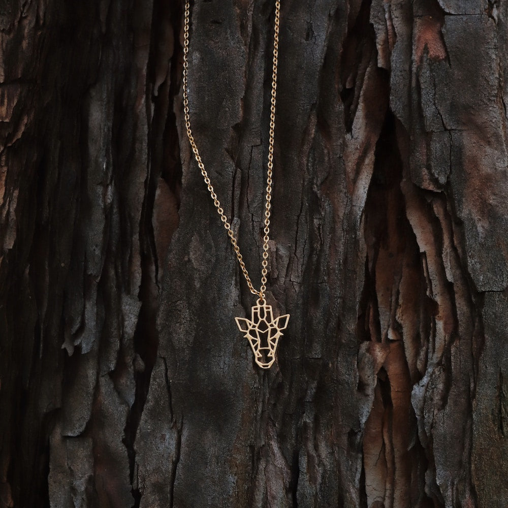 collier girafe or arbre